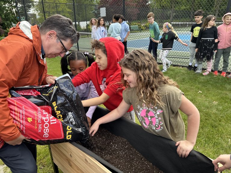 Students preparing raised bed