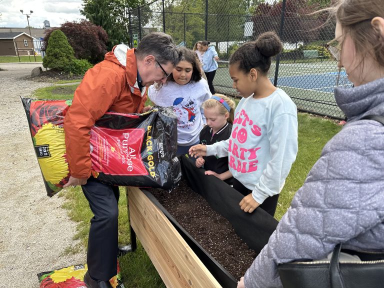 Students preparing raised bed