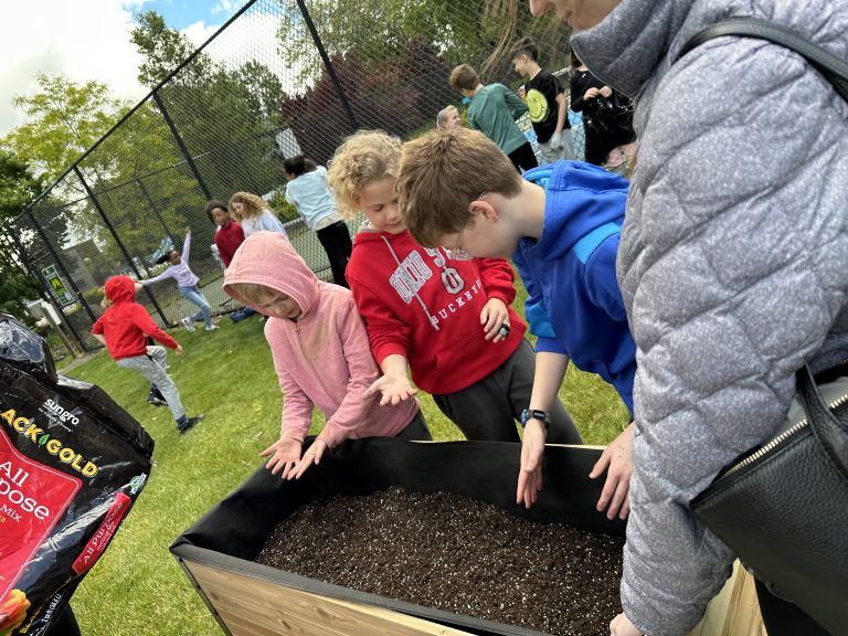Students preparing raised bed