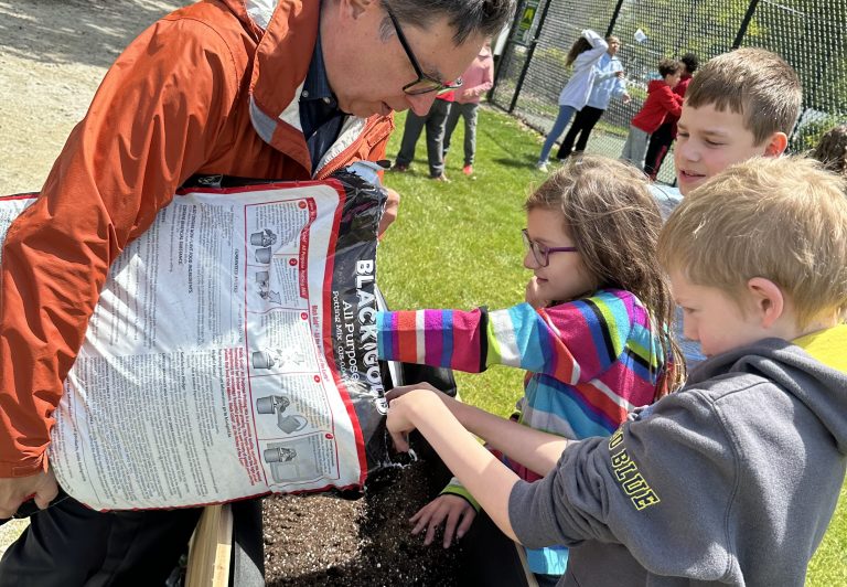 Students preparing raised bed
